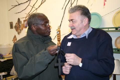 The Archbishop receives the gift of a specially carved cross made of bog oak