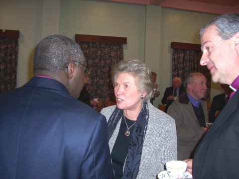 The Bishop looks on as the Archbishop chats